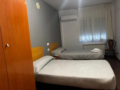 Cama o camas de una habitación en Hostal Casa Casado