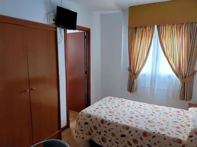 Cama o camas de una habitación en Hostal Casa Pepe