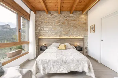 Cama o camas de una habitación en Cova Cuberes