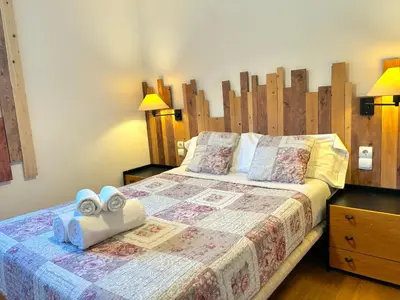 Cama o camas de una habitación en Apartament amb balcó i unes vistes úniques del Pirineu by RURAL D'ÀNEU