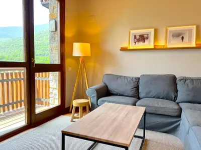Zona de estar de Apartament rústic amb encant i balcó by RURAL D'ÀNEU