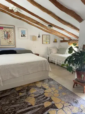 Cama o camas de una habitación en Casa del Rellotge