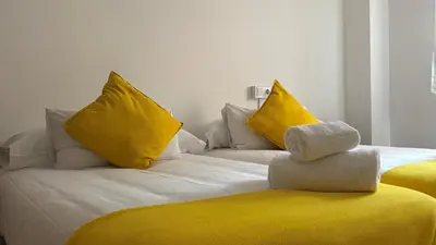 Cama o camas de una habitación en Hostal Batallar