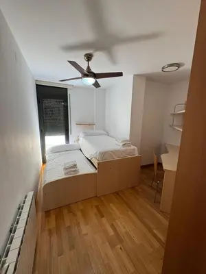 Cama o camas de una habitación en El teu habitatge a Tremp