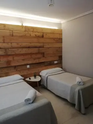 Cama o camas de una habitación en Hostal Ochoa