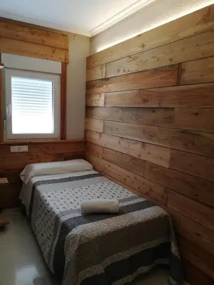 Cama o camas de una habitación en Hostal Ochoa