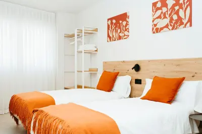 Cama o camas de una habitación en Hostal Ainhoa