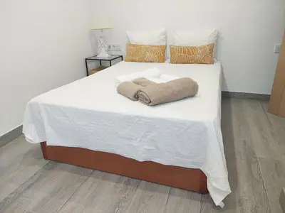 Cama o camas de una habitación en El Rincón de San Fermín
