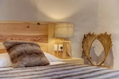 Cama o camas de una habitación en Casa Montlude - Elegancia rústica y confort moderno en el corazón del Valle de Arán by Eth Flòc