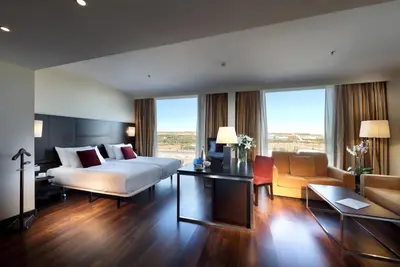 Cama o camas de una habitación en Eurostars Zaragoza