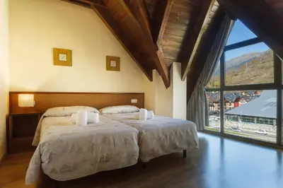 Cama o camas de una habitación en Aparthotel La Vall Blanca