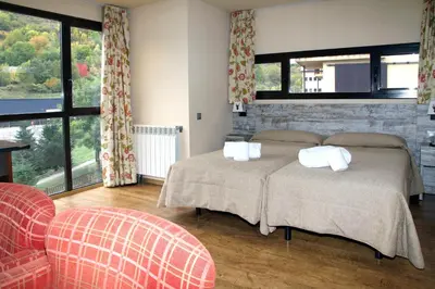 Cama o camas de una habitación en Aparthotel La Vall Blanca