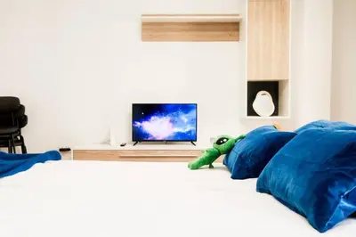 Una televisión o centro de entretenimiento en Casa Cosmos Arcade WiFi 4 Huéspedes