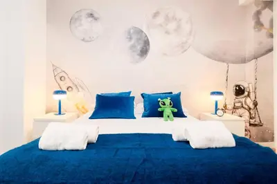 Cama o camas de una habitación en Casa Cosmos Arcade WiFi 4 Huéspedes