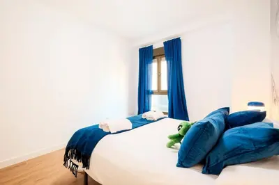 Cama o camas de una habitación en Casa Cosmos Arcade WiFi 4 Huéspedes