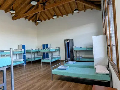 Cama o camas de una habitación en Albergue Municipal Las Escuelas