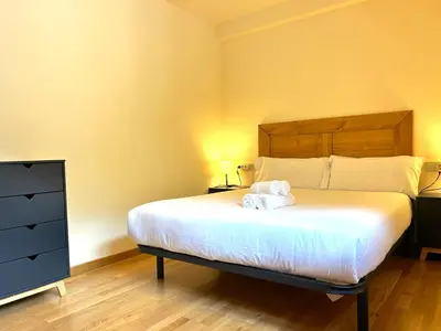 Cama o camas de una habitación en Apartament de muntanya i lluminós by RURAL D'ÀNEU