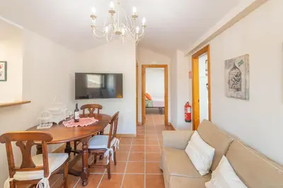 Una televisión o centro de entretenimiento en Acogedores apartamentos a 10 minutos de Pamplona