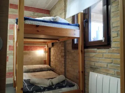 Cama o camas de una habitación en Alojamientos Acá y Allá