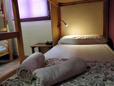 Cama o camas de una habitación en Alojamientos Acá y Allá
