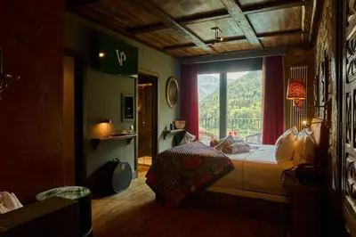 Cama o camas de una habitación en Hotel Valle de Pineta - Las Suites