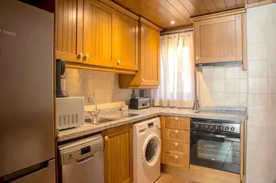 Una cocina o zona de cocina en Apartament familiar de luxe i balcó amb vistes by RURAL D'ÀNEU