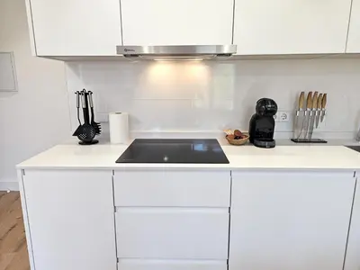 Una cocina o zona de cocina en Apartamentos Zaragoza Reconquista 3000