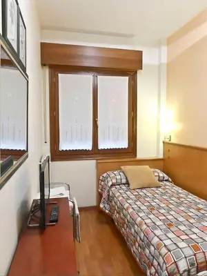 Cama o camas de una habitación en Pensión USOA