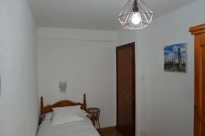 Cama o camas de una habitación en Apartamento en La Romareda a 10 min del centro en tranvía - Alfonso Suites