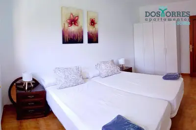 Cama o camas de una habitación en Dos Torres Nicanor Bussines