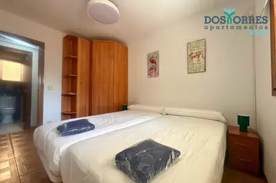 Cama o camas de una habitación en Dos Torres Nicanor Bussines