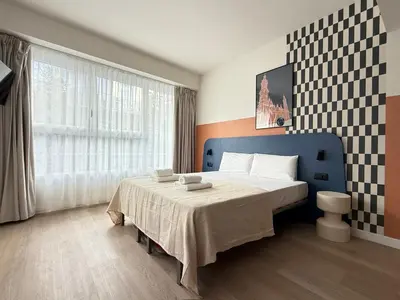 Cama o camas de una habitación en Groma Rooms