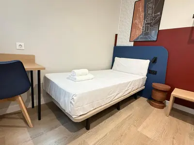 Cama o camas de una habitación en Groma Rooms
