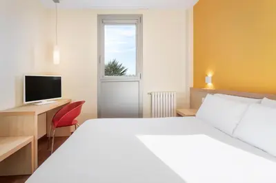 Cama o camas de una habitación en Hotel 280 Zaragoza
