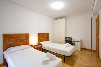 Cama o camas de una habitación en El Corazón de San Juan