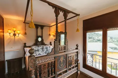 Un balcón o terraza de Masia Boutique con Infinity Pool