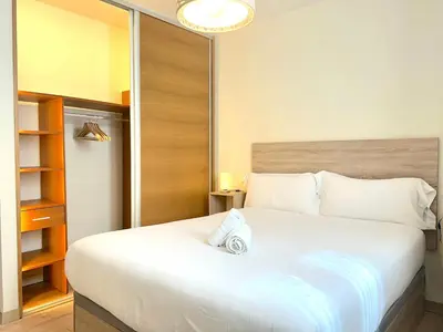 Cama o camas de una habitación en Apartament encantador amb llar de foc by RURAL D'ÀNEU