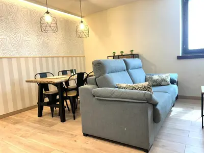 Zona de estar de Apartament encantador amb llar de foc by RURAL D'ÀNEU