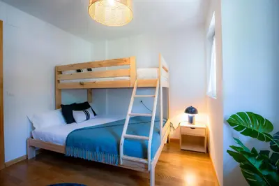 Cama o camas de una habitación en Pinaserena Chic duplex with garden in Villanúa