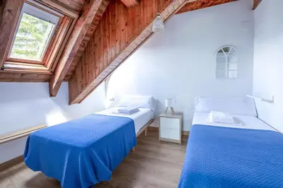 Cama o camas de una habitación en Las casitas de mache - MODESTO