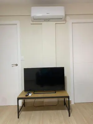 Una televisión o centro de entretenimiento en Apartamento Boston