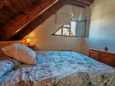 Cama o camas de una habitación en Dúplex acogedor con chimenea cerca de Aigüestortes - Falcó 6