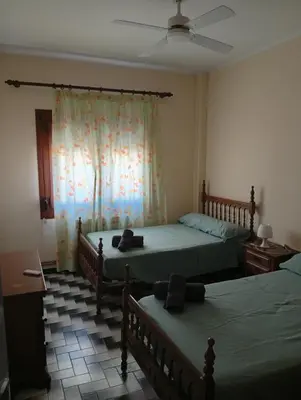Cama o camas de una habitación en Alojamiento Cervantes