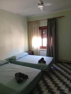 Cama o camas de una habitación en Alojamiento Cervantes