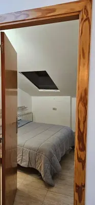 Cama o camas de una habitación en Cozy attic apartment