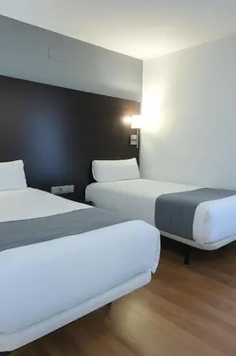 Cama o camas de una habitación en VTZ Hotel Plaza España