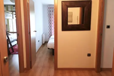 Cama o camas de una habitación en Casa con jardín y vistas a la montaña
