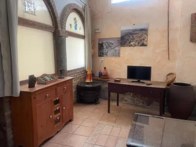 Una televisión o centro de entretenimiento en Casa Rural 