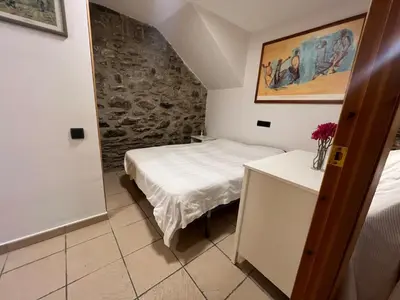 Cama o camas de una habitación en Acogedor Apartamento de Montaña