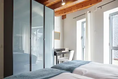 Cama o camas de una habitación en Val Arties 3 by FeelFree Rentals
